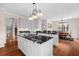 Bright kitchen features white cabinets and dark granite countertops at 2191 Lakeview Pkwy, Villa Rica, GA 30180