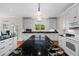 Kitchen area features black granite countertops and white cabinets at 2191 Lakeview Pkwy, Villa Rica, GA 30180