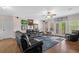 Living room with a large couch, entertainment center and French doors to the backyard at 2191 Lakeview Pkwy, Villa Rica, GA 30180