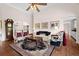 Open living room boasts high ceilings, hardwood floors, and elegant furnishings at 2191 Lakeview Pkwy, Villa Rica, GA 30180