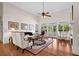 Bright living room with hardwood floors, vaulted ceilings, and lots of natural light at 2191 Lakeview Pkwy, Villa Rica, GA 30180