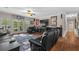 Living room with a large couch, entertainment center and French doors to the backyard at 2191 Lakeview Pkwy, Villa Rica, GA 30180