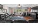 Living room with a large couch, entertainment center and French doors to the backyard at 2191 Lakeview Pkwy, Villa Rica, GA 30180