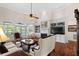 Bright living room features fireplace, built-ins, hardwood floors, and access to deck at 2191 Lakeview Pkwy, Villa Rica, GA 30180