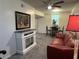 Cozy living room with stylish fireplace, plush seating, and an inviting dining area bathed in natural light at 2833 Oldknow Nw Dr, Atlanta, GA 30318
