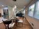 Open-concept living and dining area with hardwood floors and stylish lighting at 2833 Oldknow Nw Dr, Atlanta, GA 30318