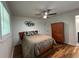 Cozy bedroom featuring hardwood floors, ceiling fan, and ample closet space at 2833 Oldknow Nw Dr, Atlanta, GA 30318