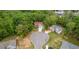 Aerial view of a residential property in a lush, green, wooded neighborhood at 31 Fairview Oak Cv, Dallas, GA 30157