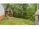 Backyard featuring a shed with a red staircase to the house at 31 Fairview Oak Cv, Dallas, GA 30157