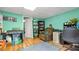 Finished basement featuring a workspace, hardwood floors, and a utility area at 31 Fairview Oak Cv, Dallas, GA 30157