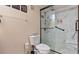 Bathroom featuring a toilet and remodeled marble-walled shower with a rain shower head at 31 Fairview Oak Cv, Dallas, GA 30157