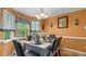 Dining area with a large window overlooking a tree filled area and seating for six at 31 Fairview Oak Cv, Dallas, GA 30157