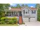 Charming two-story home with a welcoming front porch and a well-manicured lawn at 31 Fairview Oak Cv, Dallas, GA 30157