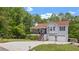 Charming two-story home with a well-manicured lawn, two car garage, and beautiful porch at 31 Fairview Oak Cv, Dallas, GA 30157