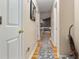 Inviting hallway with hardwood floors leading to the main living areas of the home at 31 Fairview Oak Cv, Dallas, GA 30157