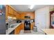 Cozy kitchen with wooden cabinets, granite countertops, and stainless steel appliances at 31 Fairview Oak Cv, Dallas, GA 30157