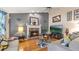 Comfortable living room with a brick fireplace and TV above the mantelpiece at 31 Fairview Oak Cv, Dallas, GA 30157
