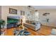 Inviting living room with hardwood floors, modern furniture, and a bright, open layout at 31 Fairview Oak Cv, Dallas, GA 30157
