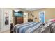 Spacious main bedroom, complete with a mounted TV, en suite bath, and closet at 31 Fairview Oak Cv, Dallas, GA 30157