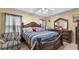 Main bedroom with an ornate wooden bed and matching furniture at 31 Fairview Oak Cv, Dallas, GA 30157