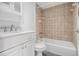 Clean bathroom with white vanity, marble countertop, and tiled shower/tub combo at 620 Peachtree Ne St # 601, Atlanta, GA 30308