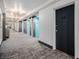 Well-maintained hallway with carpet flooring and multiple elevator access points at 620 Peachtree Ne St # 601, Atlanta, GA 30308