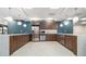 Well-appointed common kitchen featuring stainless steel appliances, wood cabinetry and a light backsplash at 620 Peachtree Ne St # 601, Atlanta, GA 30308