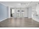 Open-concept living room showcasing wood-look floors, balcony access, and seamless flow to a snack bar counter at 620 Peachtree Ne St # 601, Atlanta, GA 30308