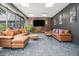 Relaxing lounge area with comfortable seating, large-screen TV, and contemporary decor at 620 Peachtree Ne St # 601, Atlanta, GA 30308