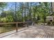 A spacious backyard deck overlooking the large private backyard and shed at 6835 Sunny Brook Ln, Atlanta, GA 30328