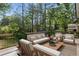 A spacious outdoor seating area with plush sofas, comfortable chairs and a well-maintained deck at 6835 Sunny Brook Ln, Atlanta, GA 30328