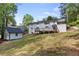 Backyard featuring a large backyard, outdoor shed, back patio and a two story home at 6835 Sunny Brook Ln, Atlanta, GA 30328