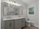 Bright bathroom with a double vanity, gold fixtures, and a large mirror, creating a spa-like atmosphere at 6835 Sunny Brook Ln, Atlanta, GA 30328