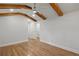 Primary bedroom featuring hardwood floors and a vaulted ceiling with exposed wood beams at 6835 Sunny Brook Ln, Atlanta, GA 30328