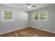 Bedroom featuring hardwood floors, a ceiling fan, and natural light, creating a comfortable atmosphere at 6835 Sunny Brook Ln, Atlanta, GA 30328