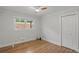 Bedroom featuring hardwood floors, double closet, and a ceiling fan, offering ample storage at 6835 Sunny Brook Ln, Atlanta, GA 30328