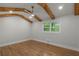 Primary bedroom featuring hardwood floors and a window with natural light at 6835 Sunny Brook Ln, Atlanta, GA 30328