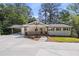 Charming renovated home with a large front yard, a covered carport, and a welcoming front porch at 6835 Sunny Brook Ln, Atlanta, GA 30328