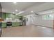 Modern kitchen featuring stainless steel appliances and green cabinets, with ample space for comfortable living at 6835 Sunny Brook Ln, Atlanta, GA 30328