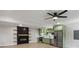 Modern kitchen featuring stainless steel appliances, green cabinets, and a ceiling fan for added comfort at 6835 Sunny Brook Ln, Atlanta, GA 30328