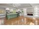 Open concept living and kitchen with fireplace and a large island, perfect for entertaining at 6835 Sunny Brook Ln, Atlanta, GA 30328
