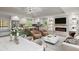 Bright and open living area featuring a modern kitchen, dining space, fireplace, and comfortable seating at 6835 Sunny Brook Ln, Atlanta, GA 30328