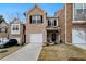 Charming brick townhouse with a one-car garage and well-maintained landscaping at 11130 Benton Woods Dr, Covington, GA 30014