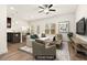 Tastefully staged living room with natural light, comfortable seating, and a modern design at 11130 Benton Woods Dr, Covington, GA 30014