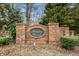 Brick signage displays the community's name, 'Benton Woods,' surrounded by greenery at 11130 Benton Woods Dr, Covington, GA 30014