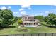 Aerial view of two-story home with backyard pool, patio, green space, and black perimeter fence at 3920 Ineal Dr, Cumming, GA 30028