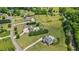 Gorgeous aerial view highlighting acreage with lush greenery and neighborhood properties at 3920 Ineal Dr, Cumming, GA 30028