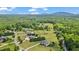 Scenic aerial showcasing lush acreage, trees, and estate properties at 3920 Ineal Dr, Cumming, GA 30028