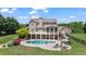 Aerial view of the backyard featuring an in-ground pool, patio, landscaping and spacious lawn at 3920 Ineal Dr, Cumming, GA 30028