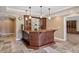 Finished basement bar area with custom wood cabinetry and stylish lighting at 3920 Ineal Dr, Cumming, GA 30028